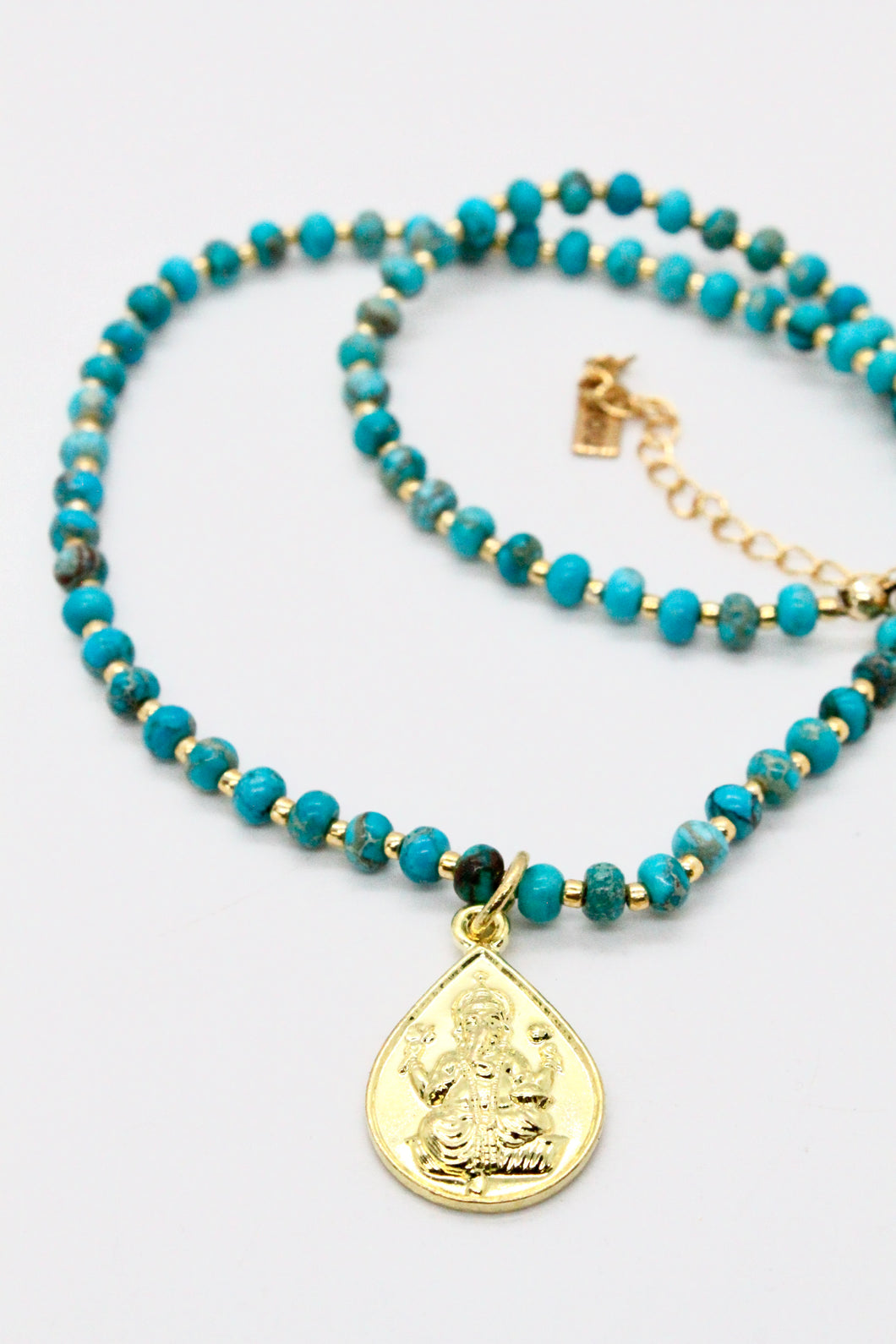 Reversible Gold Buddha Charm on Turquoise Necklace